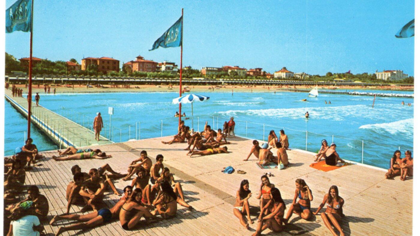 Still from Salut! Hello! Hallo! by Diego Marcon: a vintage postcard of people sunbathing on a pier at the seaside